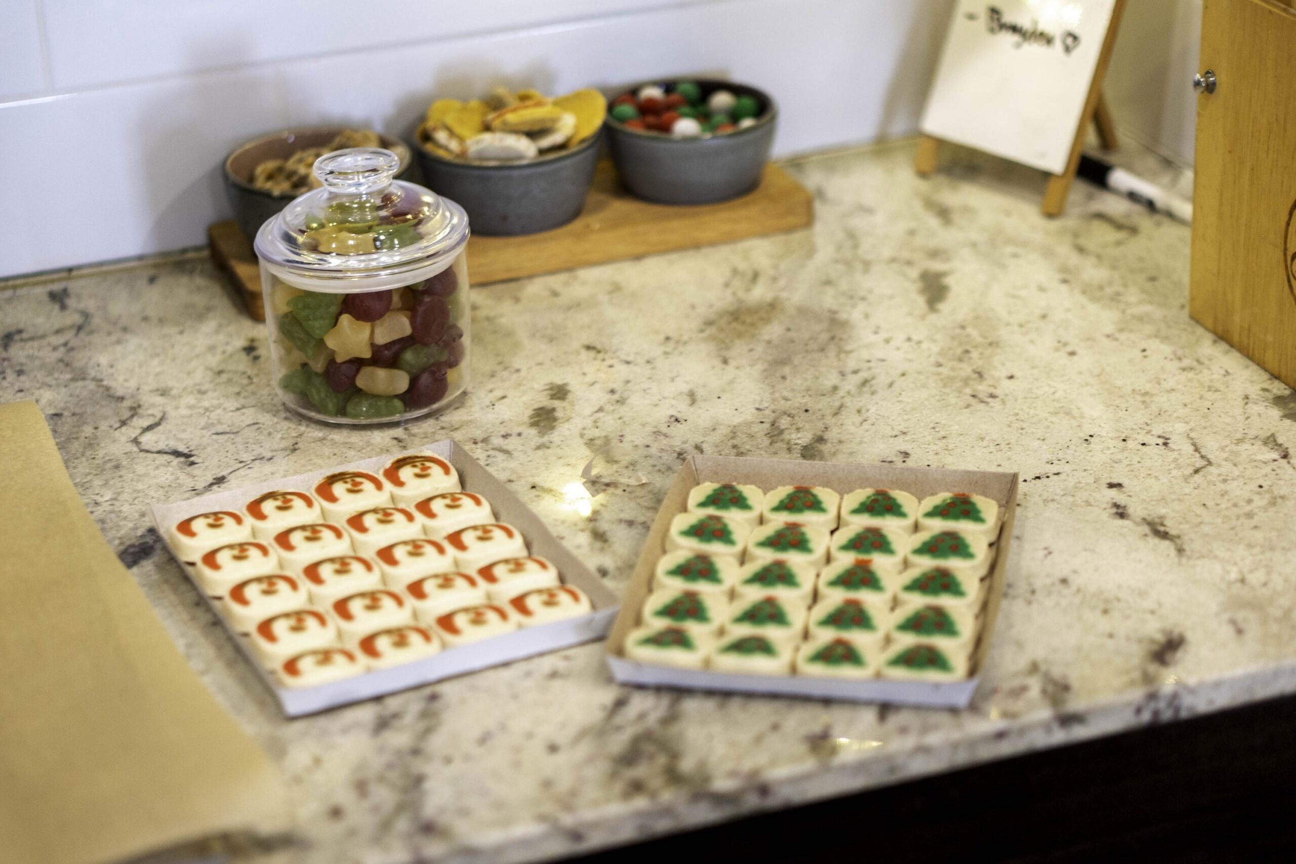 decorative tray setup for hosting guests, neatly arranged snack displays on kitchen counter top