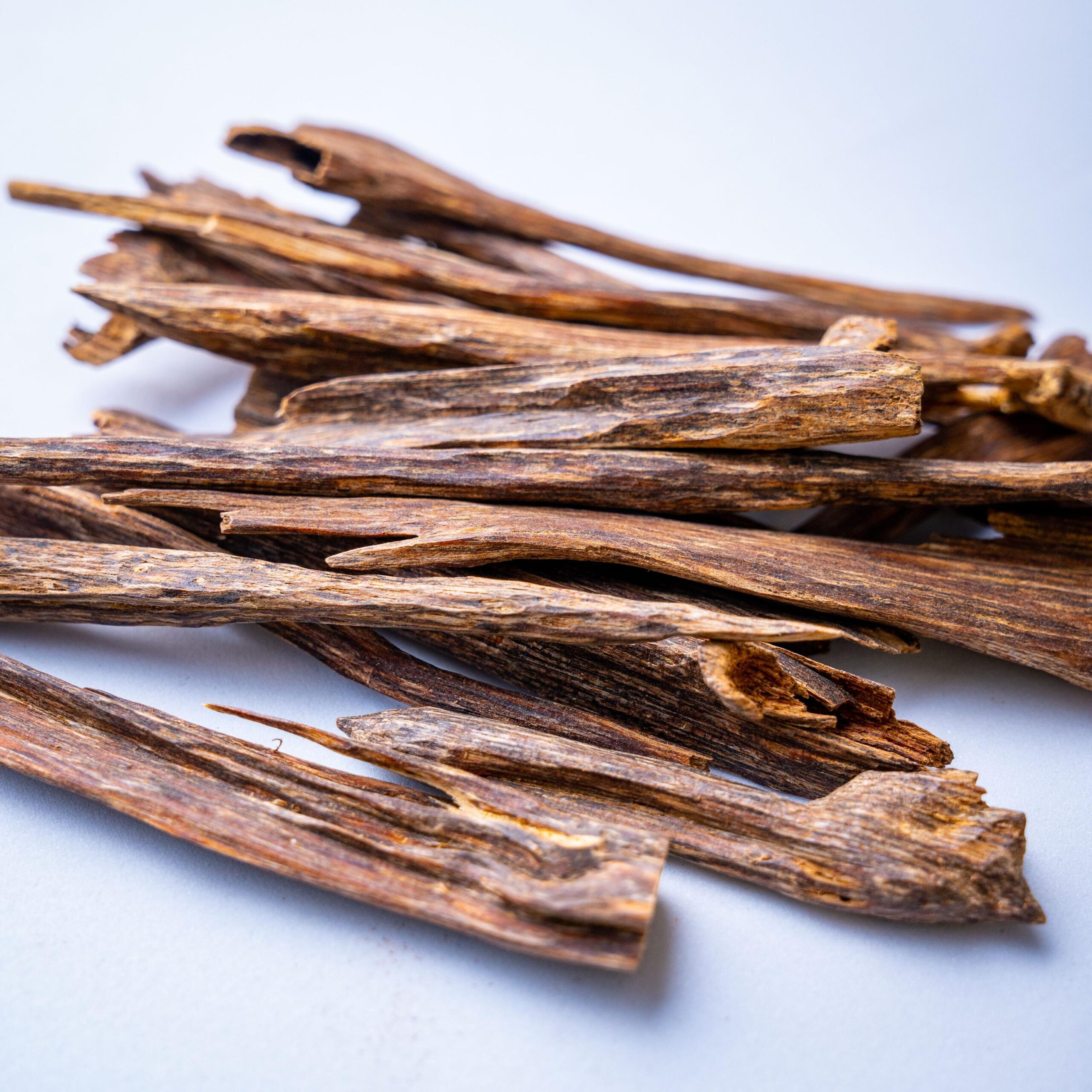Closeup of agarwood sticks on white background