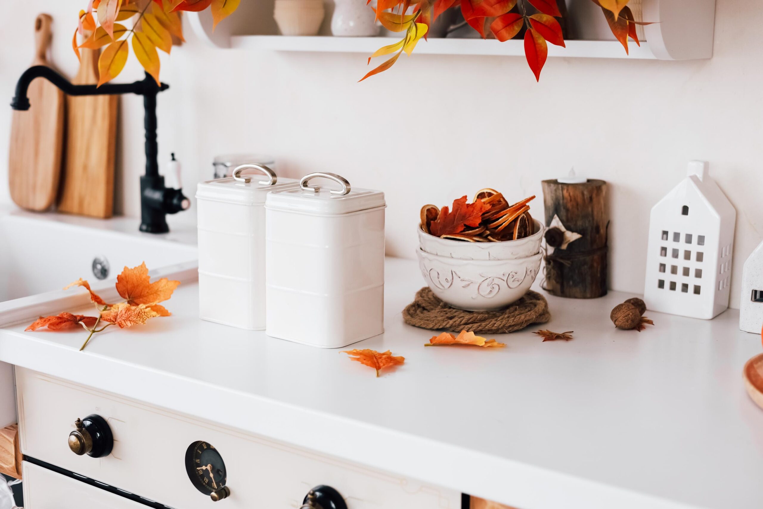 Warm autumn kitchen decor featuring leaves and cozy arrangements for seasonal ambiance