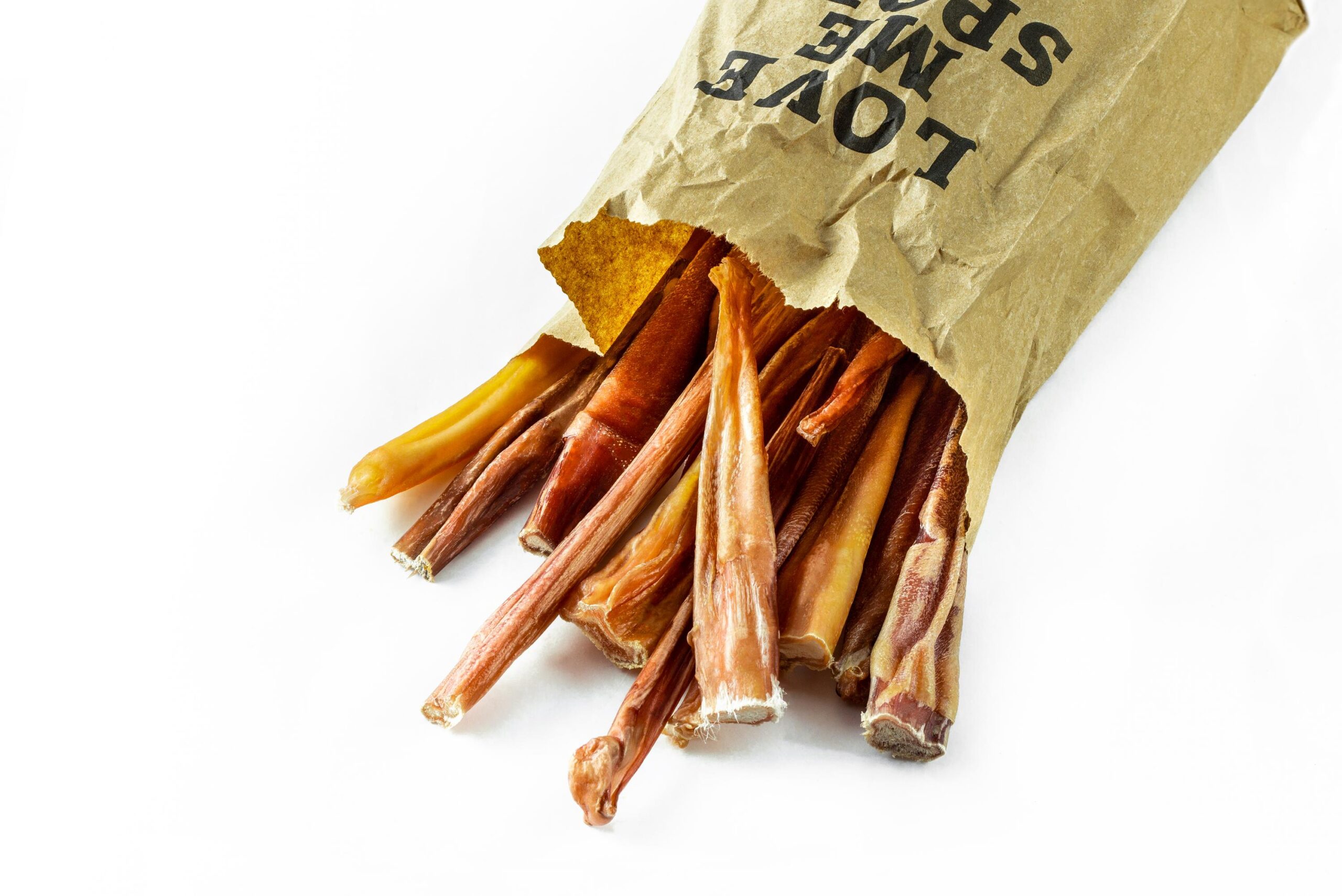 single ingredient dog treat, bully sticks in a paper bag